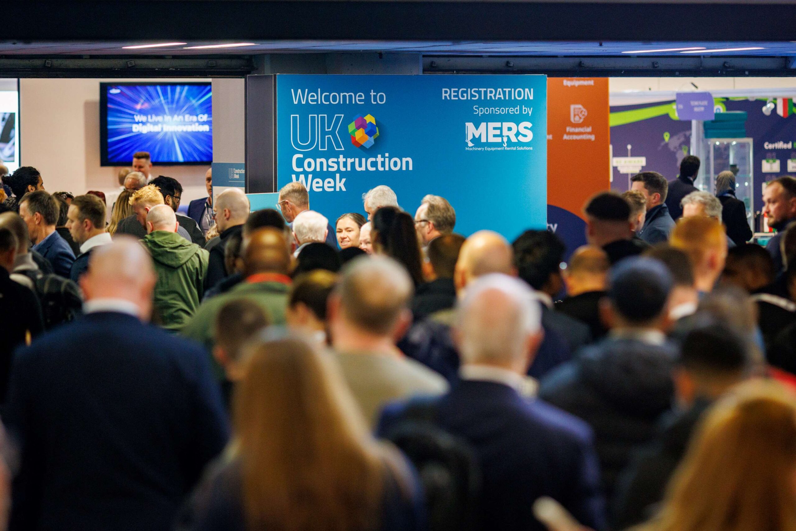 Attendees at the entrance of the UK Construction Week in Birmingham